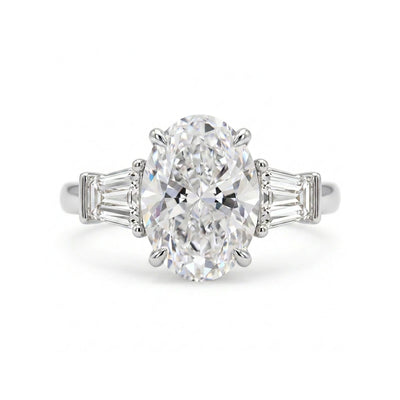 Oval Three-Stone Ring with Tapered Baguette Sides — oval and baguette lab grown diamond ring in solid hallmarked gold